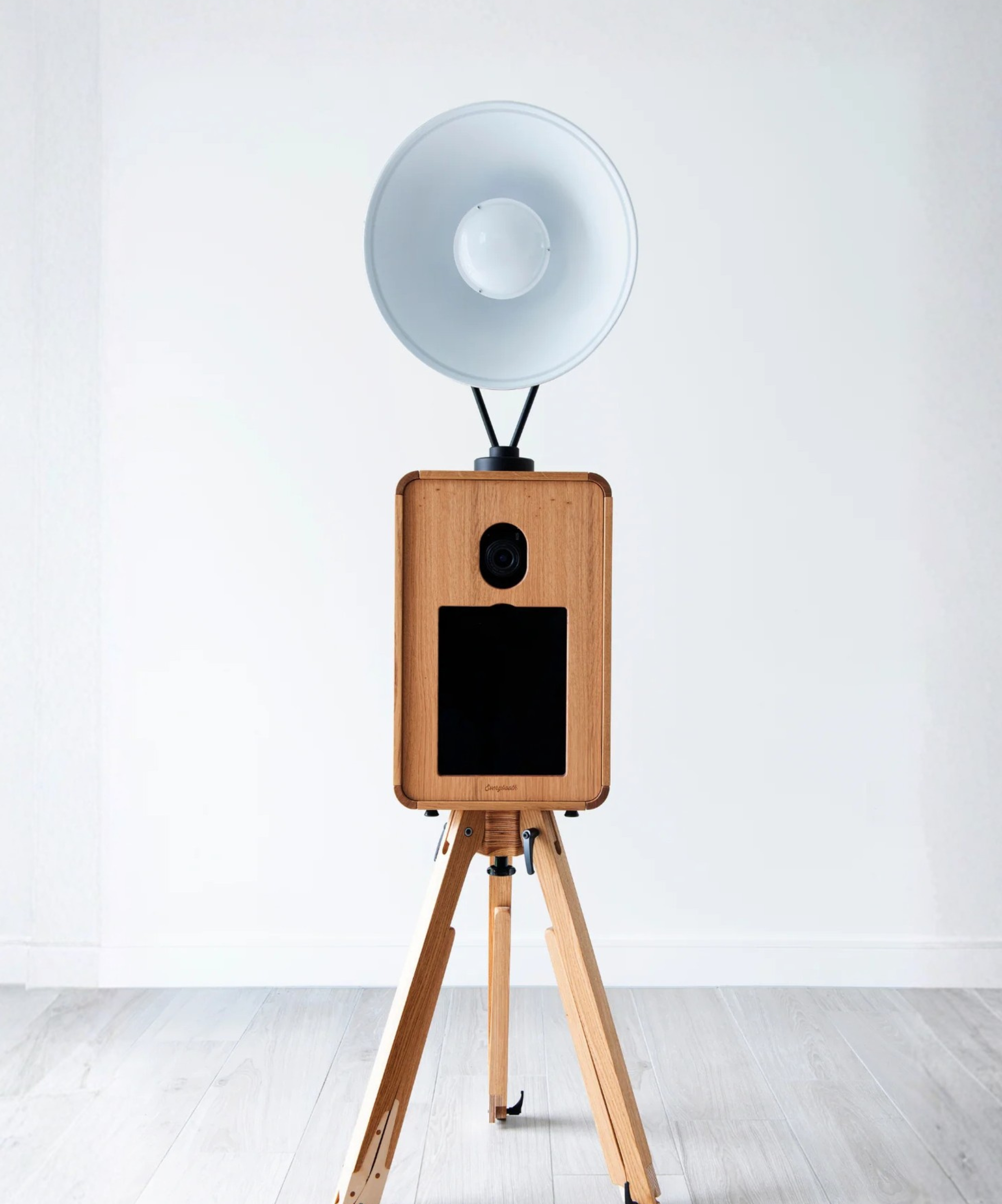 Wooden camera with a white lens on a white background photo booth hire